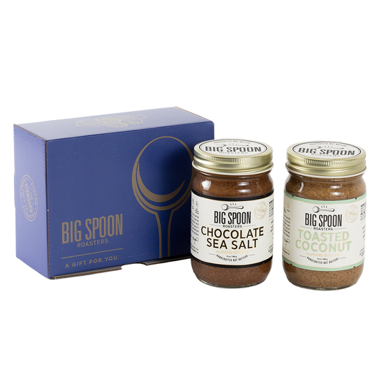 Two jars of Big Spoon Roasters nut butter next to a blue box