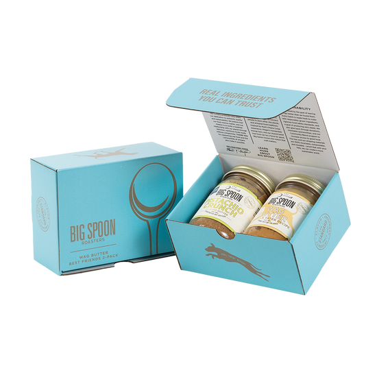 Light blue gift box with two jars of Big Spoon Roasters nut butter next to a closed blue gift box