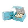 Light blue gift box with two jars of Big Spoon Roasters nut butter next to a closed blue gift box