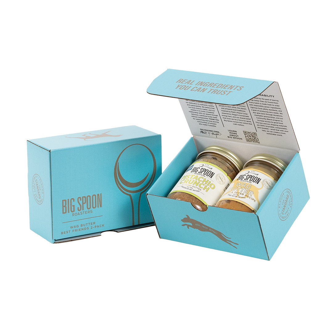 Light blue gift box with two jars of Big Spoon Roasters nut butter next to a closed blue gift box