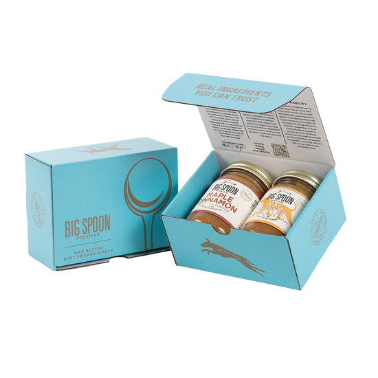 Light blue gift box with two jars of Big Spoon Roasters nut butter next to a closed blue gift box
