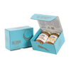Light blue gift box with two jars of Big Spoon Roasters nut butter next to a closed blue gift box