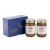 Two jars of Big Spoon Roasters nut butter next to a blue box