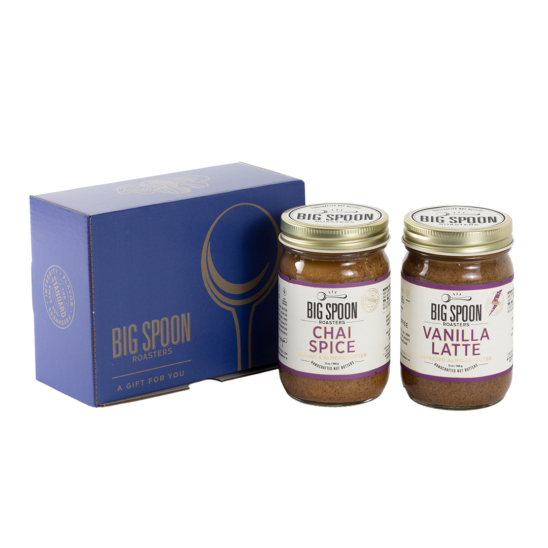 Two jars of Big Spoon Roasters nut butter next to a blue box