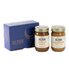 Two jars of Big Spoon Roasters nut butter next to a blue box