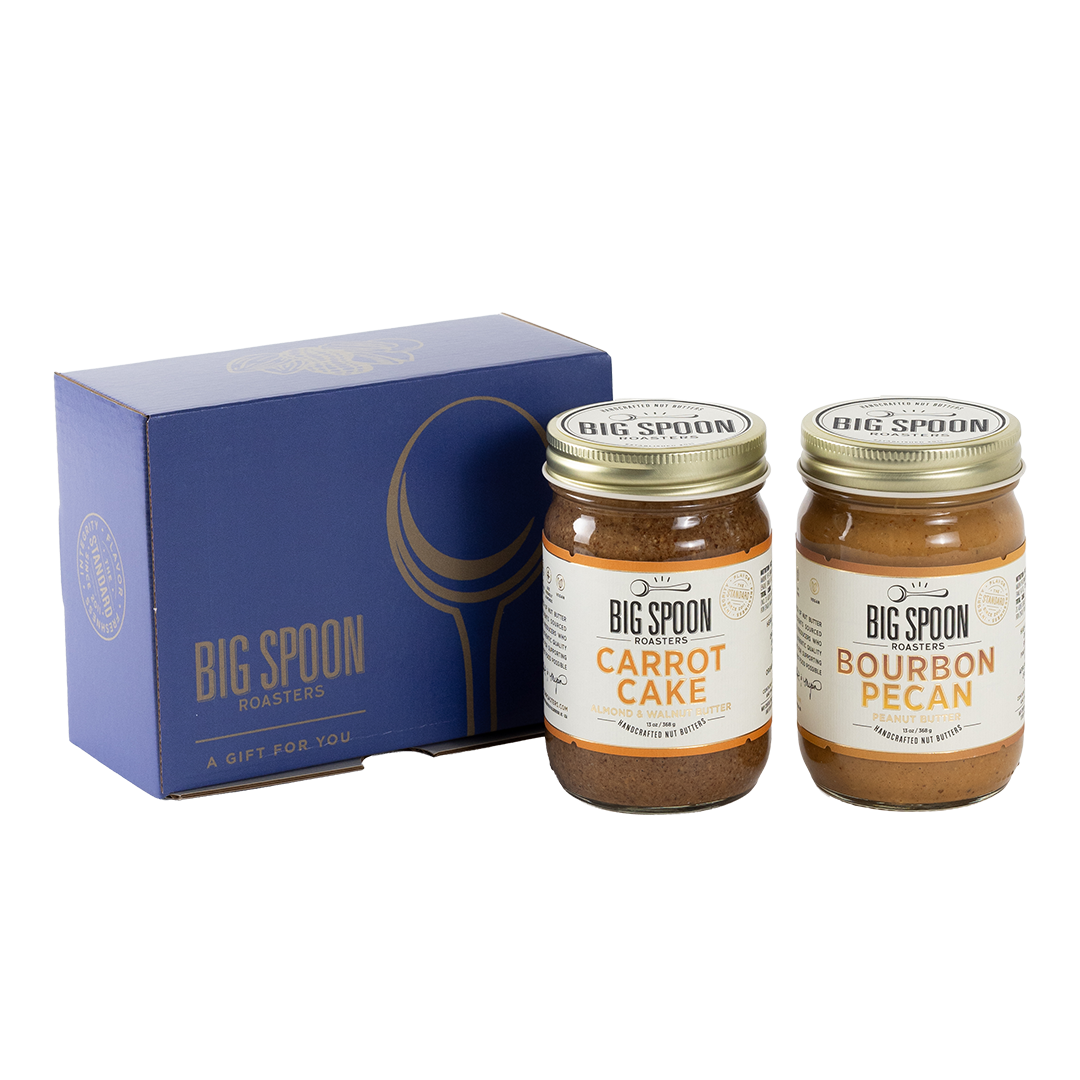 Two jars of Big Spoon Roasters nut butter next to a blue box