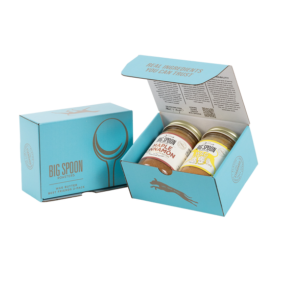 Light blue gift box with two jars of Big Spoon Roasters nut butter next to a closed blue gift box