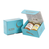 Light blue gift box with two jars of Big Spoon Roasters nut butter next to a closed blue gift box
