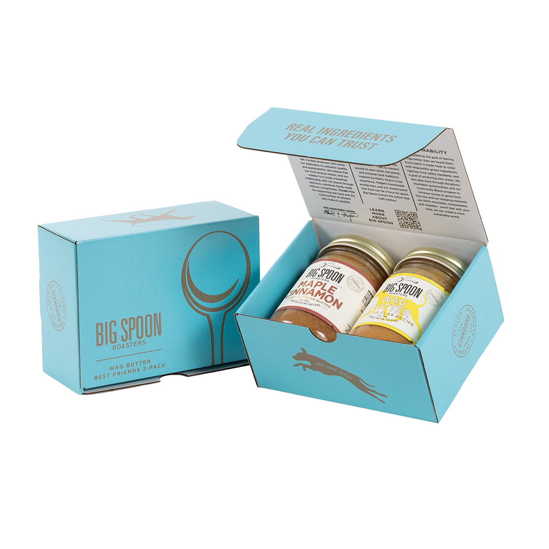 Light blue gift box with two jars of Big Spoon Roasters nut butter next to a closed blue gift box