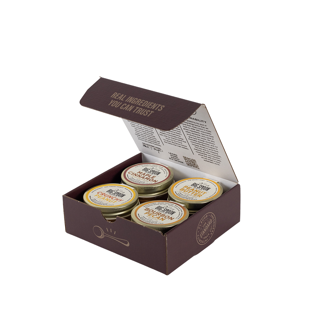 Box with four jars of Big Spoon Roasters peanut butter