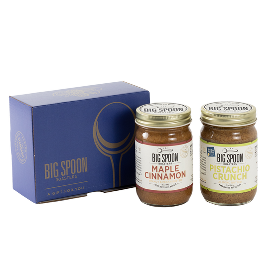 Two jars of Big Spoon Roasters nut butter next to a blue box