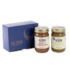 Two jars of Big Spoon Roasters nut butter next to a blue box