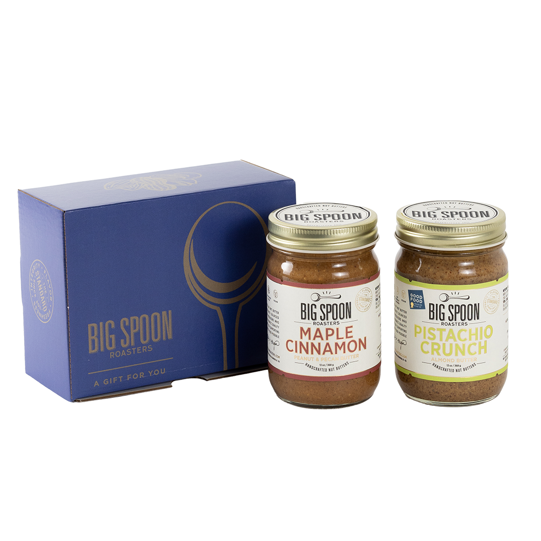 Two jars of Big Spoon Roasters nut butter next to a blue box
