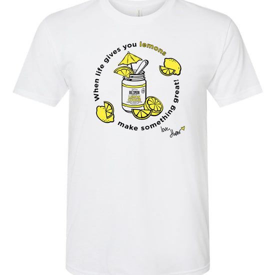 White t-shirt with illustration of jar of nut butter surrounded by lemons