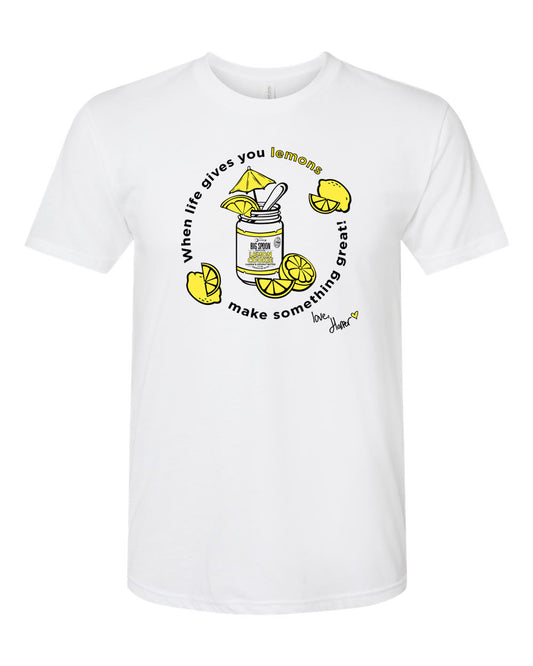 White t-shirt with illustration of jar of nut butter surrounded by lemons