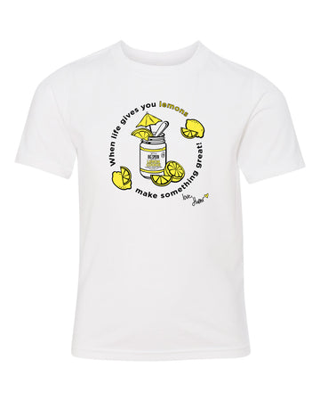 White t-shirt with illustration of jar of nut butter surrounded by lemons 