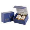 Blue gift box with two jars of Big Spoon Roasters nut butter next to a closed blue gift box