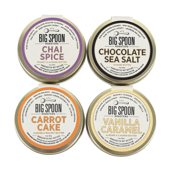 Four tins of Big Spoon Roasters nut butter on a white background