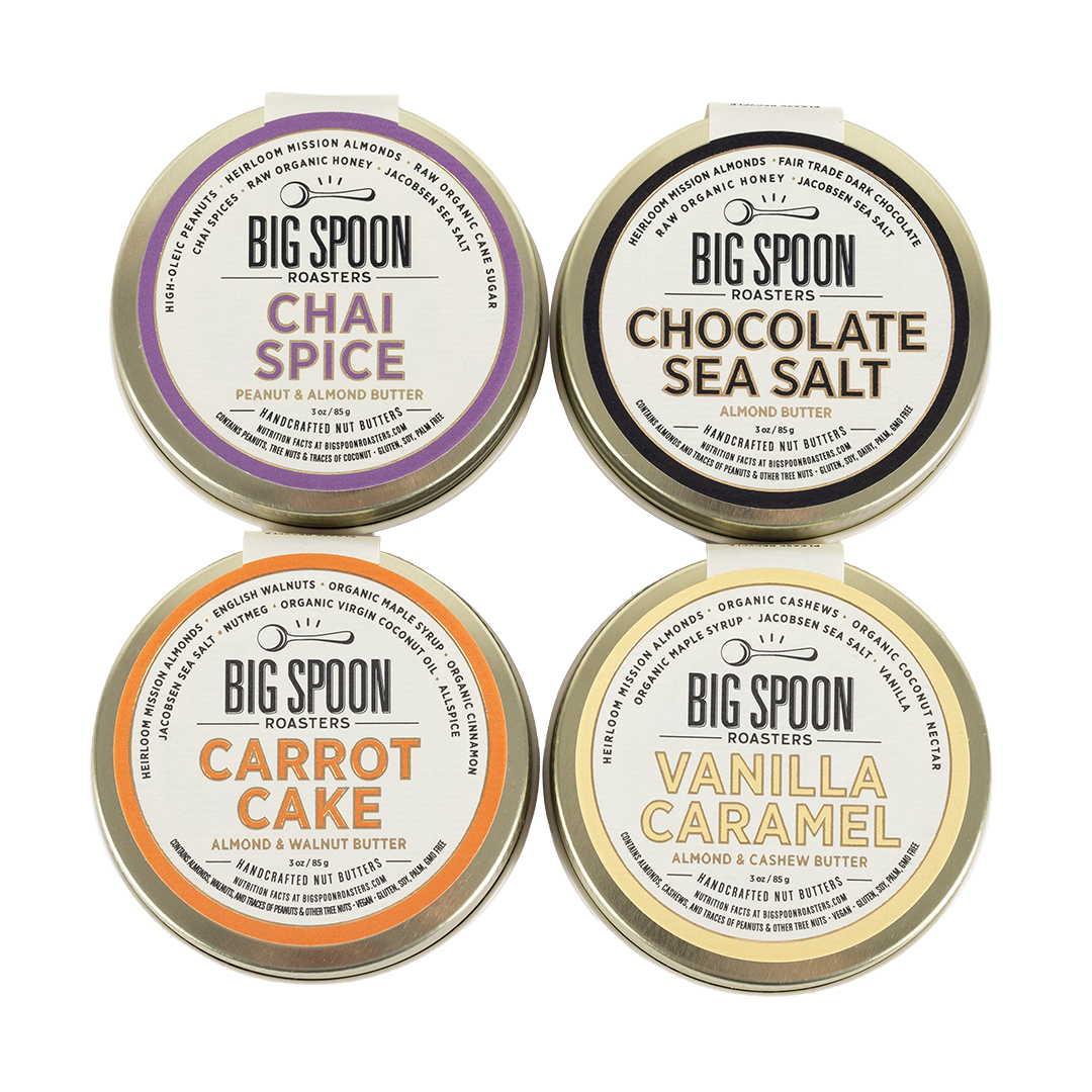 Four tins of Big Spoon Roasters nut butter on a white background