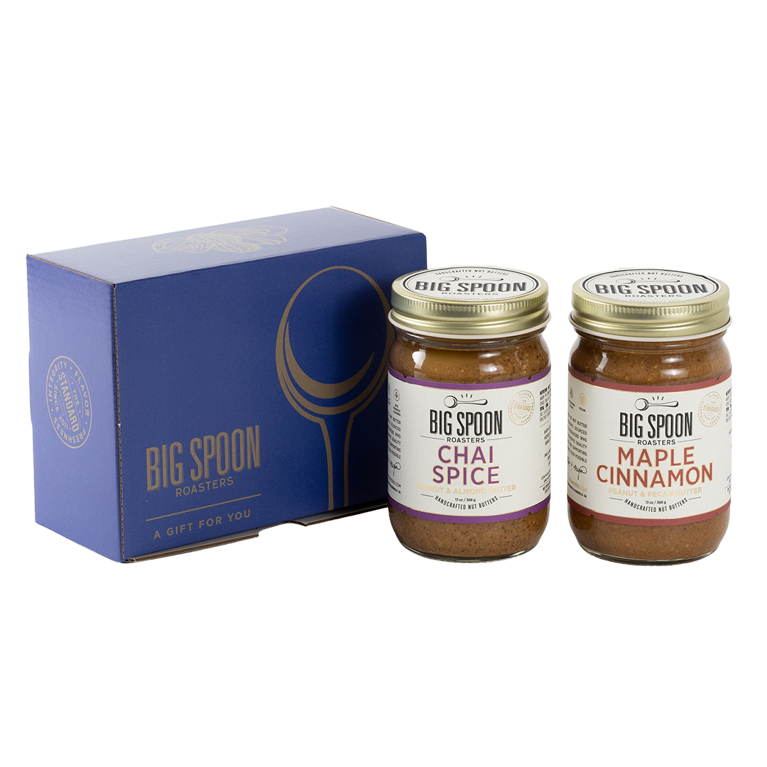 Two jars of Big Spoon Roasters nut butter next to a blue box