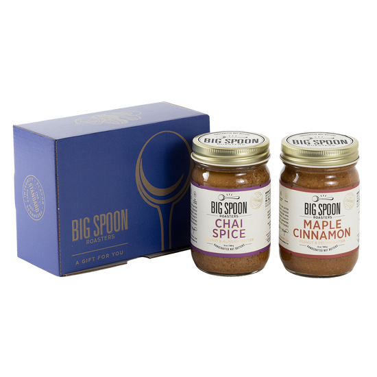 Two jars of Big Spoon Roasters nut butter next to a blue box