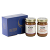 Two jars of Big Spoon Roasters nut butter next to a blue box