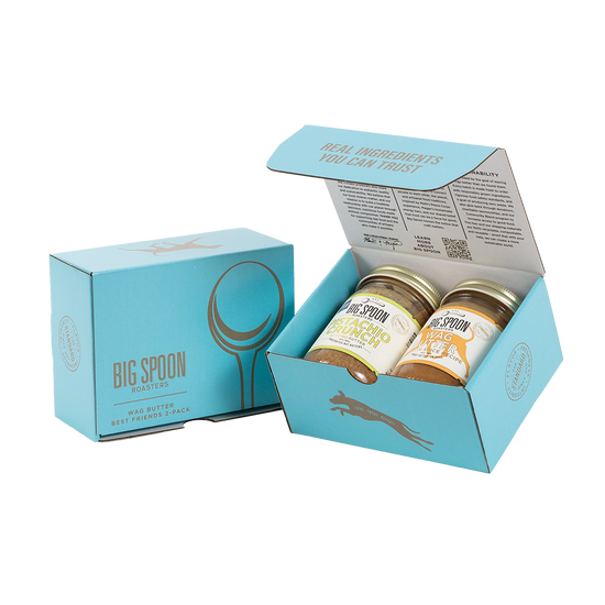 Light blue gift box with two jars of Big Spoon Roasters nut butter next to a closed blue gift box