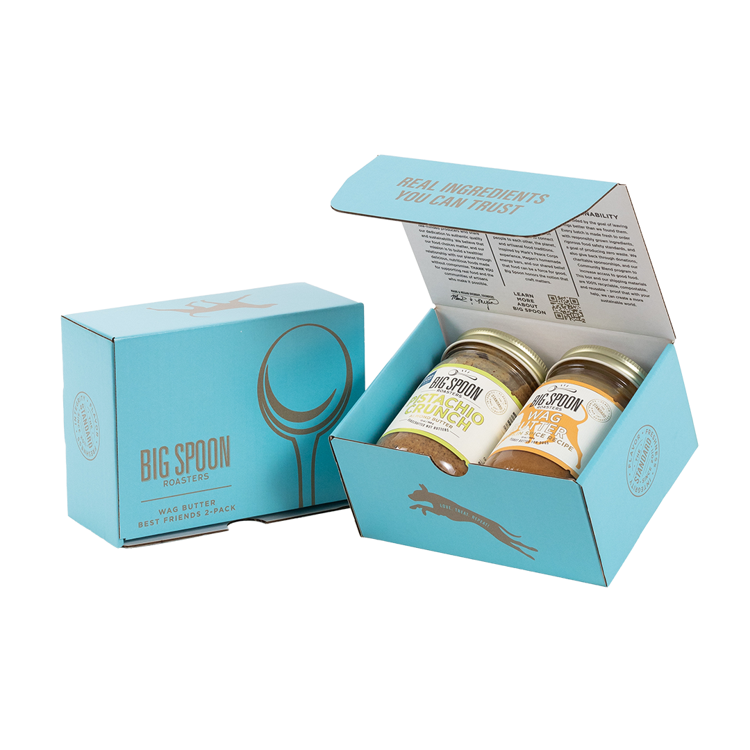 Light blue gift box with two jars of Big Spoon Roasters nut butter next to a closed blue gift box