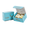 Light blue gift box with two jars of Big Spoon Roasters nut butter next to a closed blue gift box