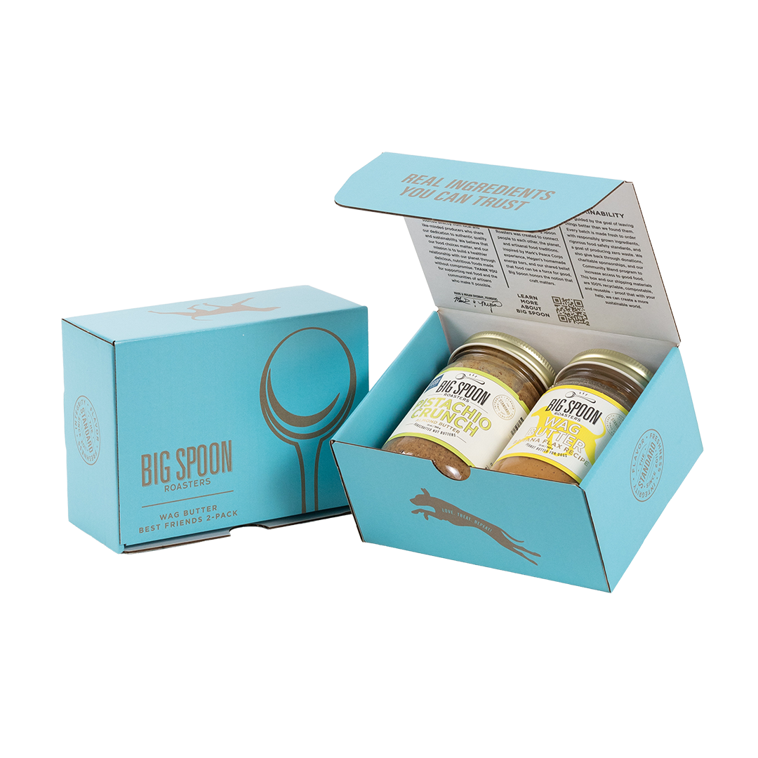 Light blue gift box with two jars of Big Spoon Roasters nut butter next to a closed blue gift box