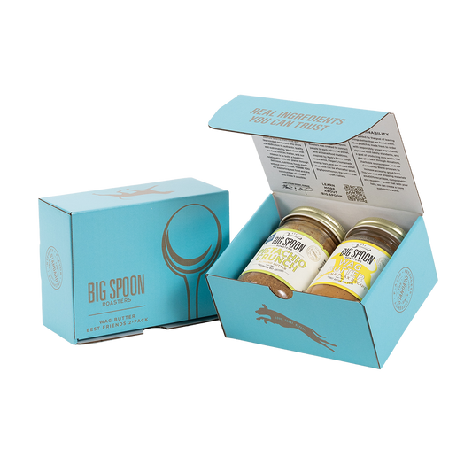 Light blue gift box with two jars of Big Spoon Roasters nut butter next to a closed blue gift box