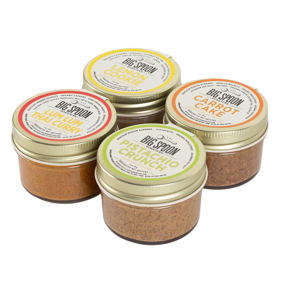 Four jars of Big Spoon nut butters on a white background