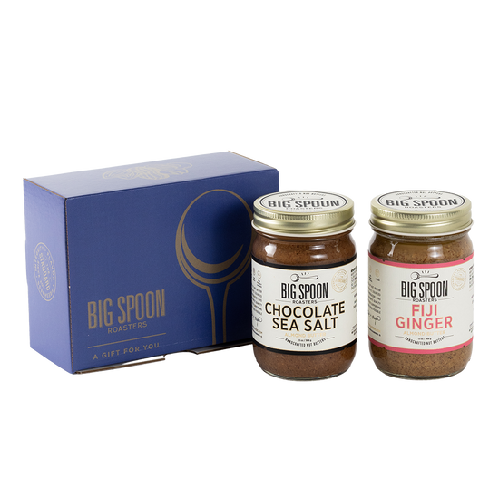 Two jars of Big Spoon Roasters nut butter next to a blue box