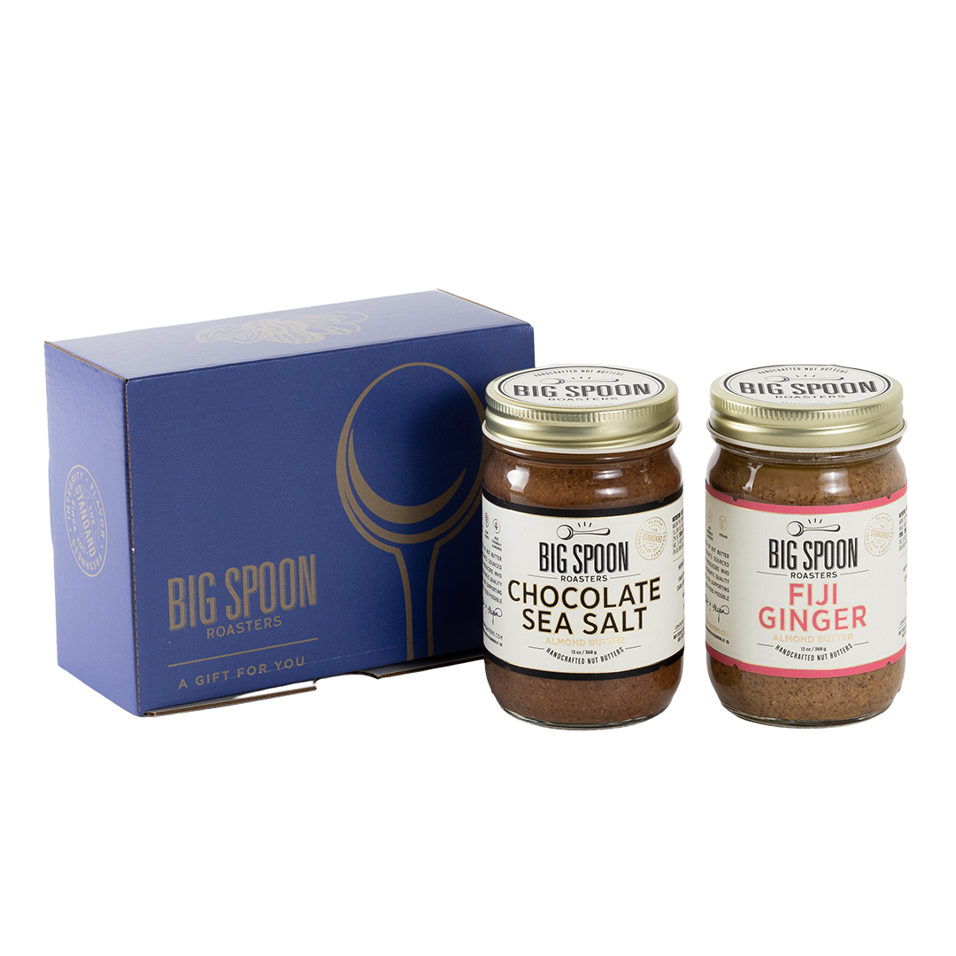 Two jars of Big Spoon Roasters nut butter next to a blue box