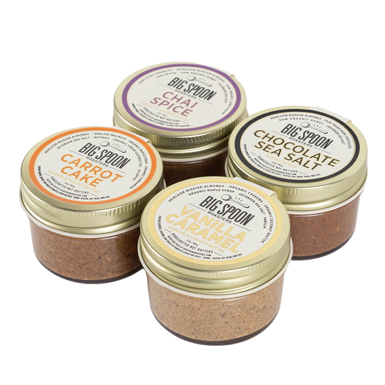 Four jars of Big Spoon nut butter on a white background