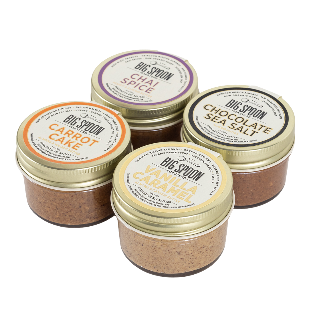 Four jars of Big Spoon nut butter on a white background